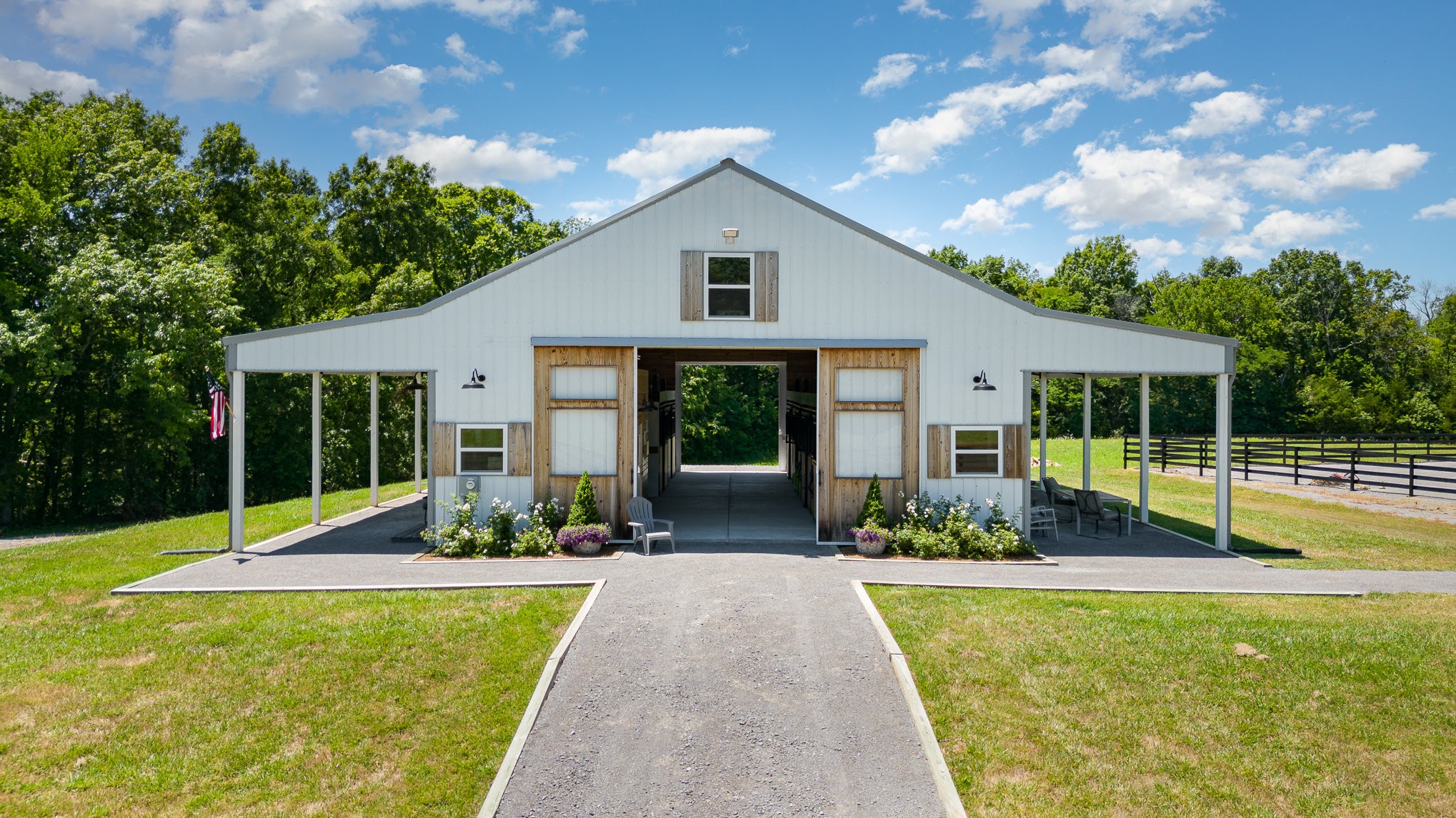 a front view of a house with a yard and porch