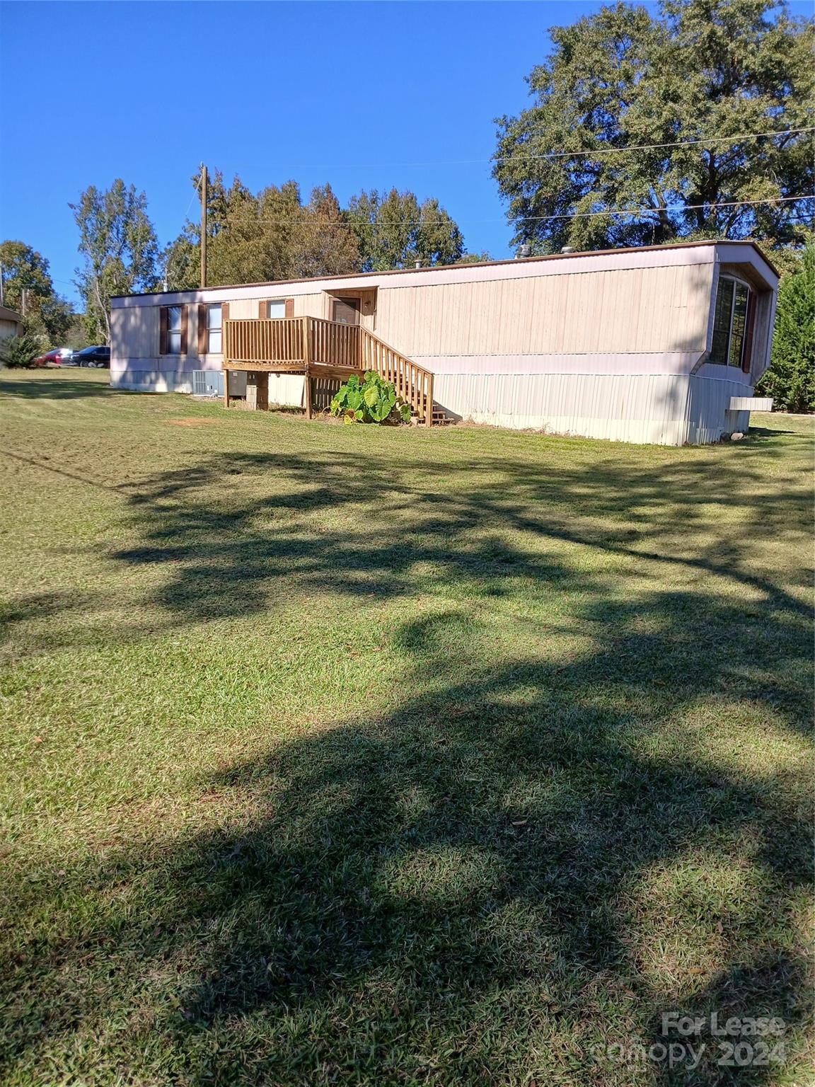 a swimming pool with lawn chairs