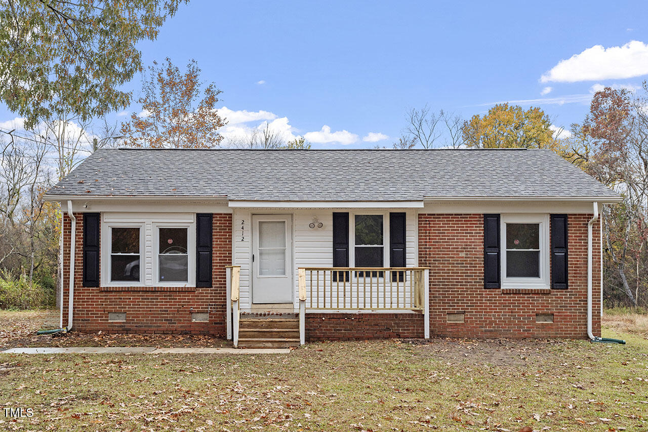 front view of a house with a yard