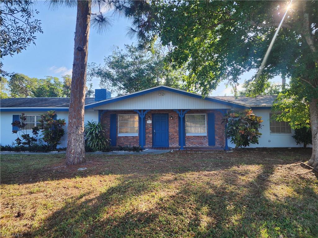 Ranch-style home with a front yard