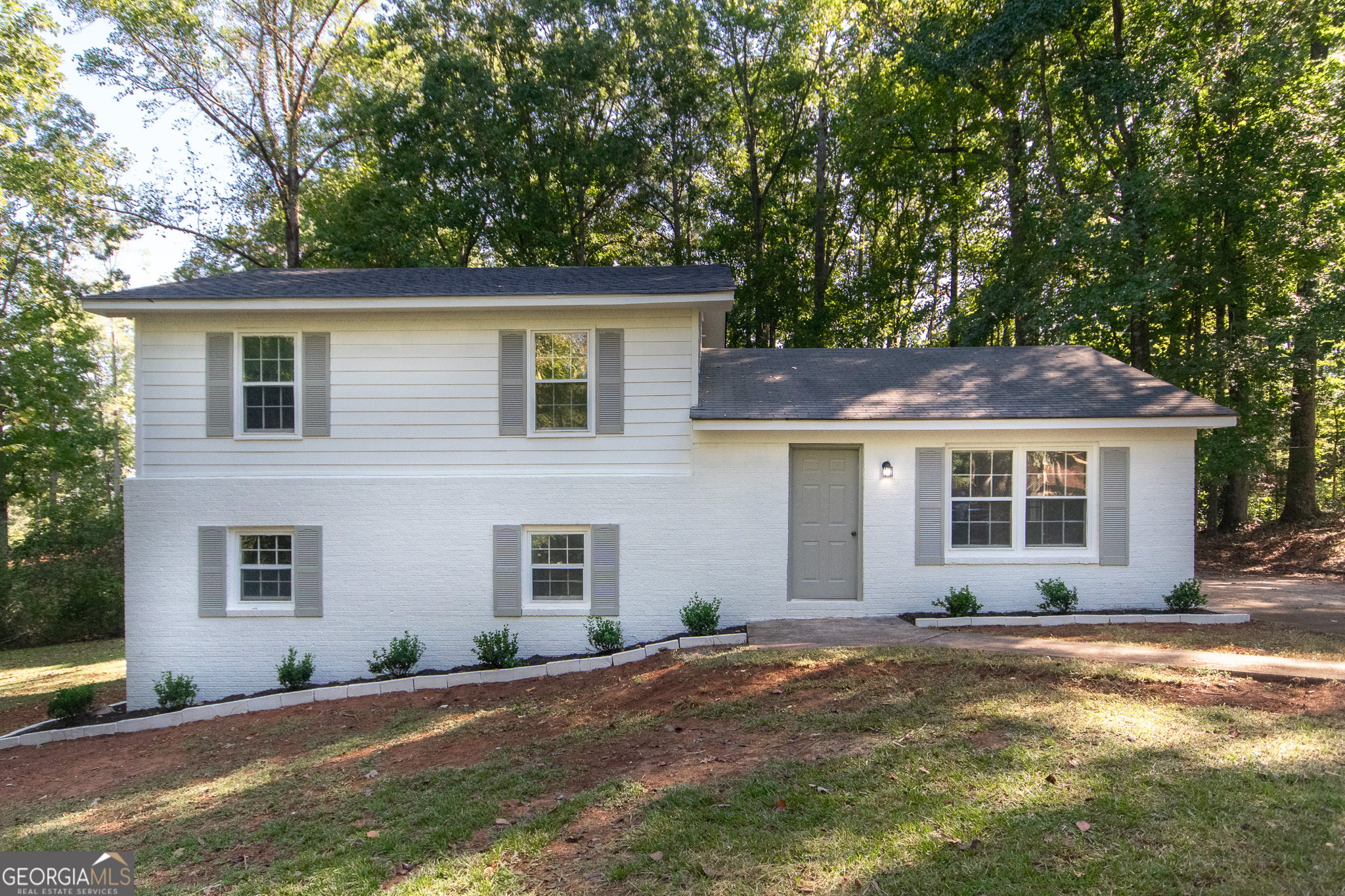 front view of a house with a yard