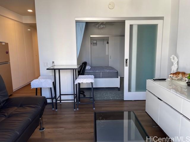 a living room with a couch and a table with wooden floor