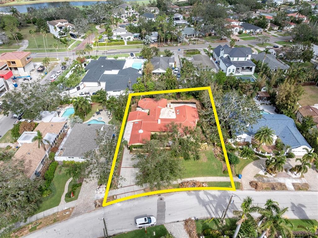 an aerial view of residential houses with yard