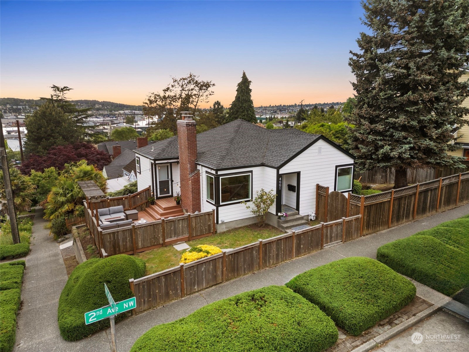 an aerial view of a house yard swimming pool and outdoor seating