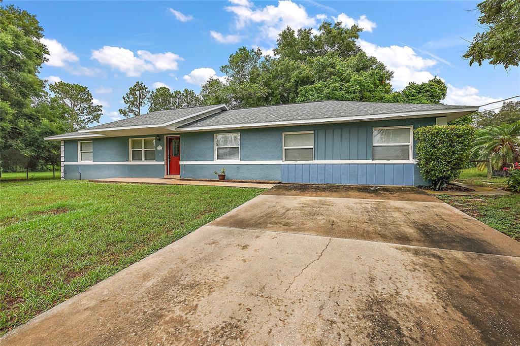 front view of a house with a yard