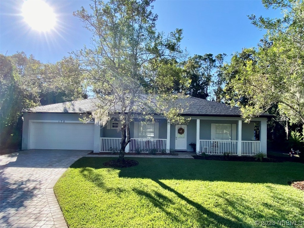 front view of a house with a yard