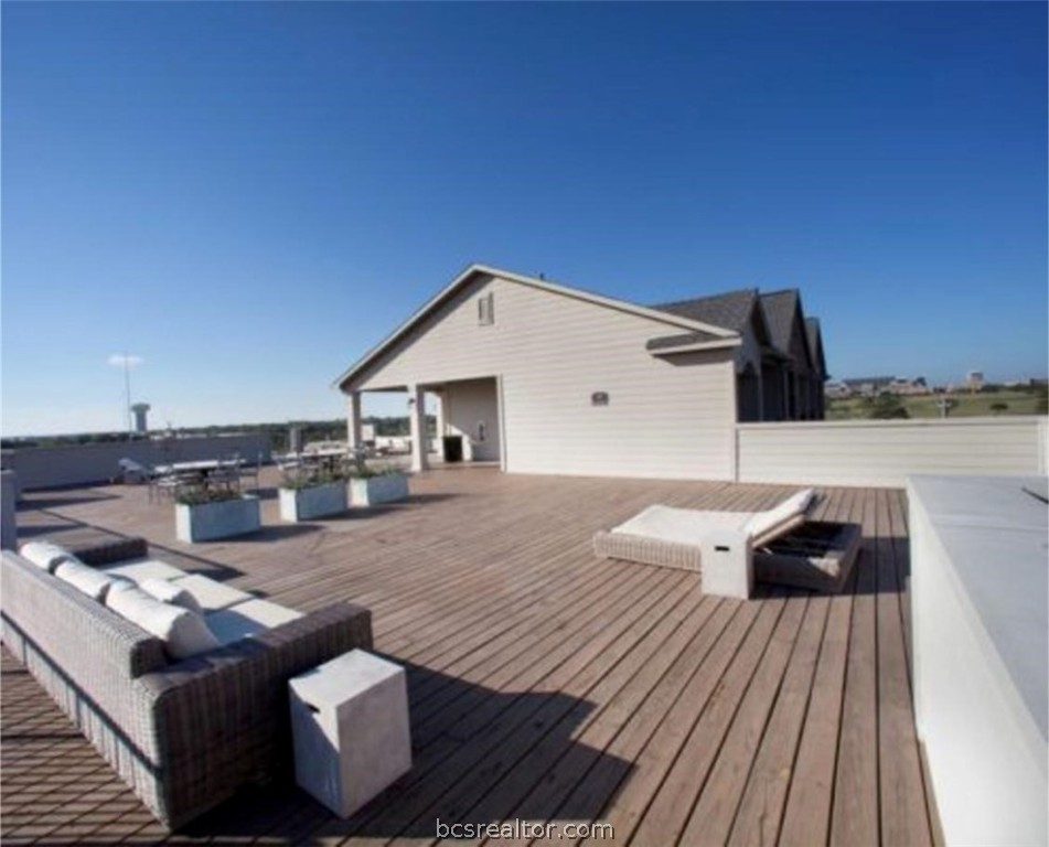 a view of barbeque area with seating area