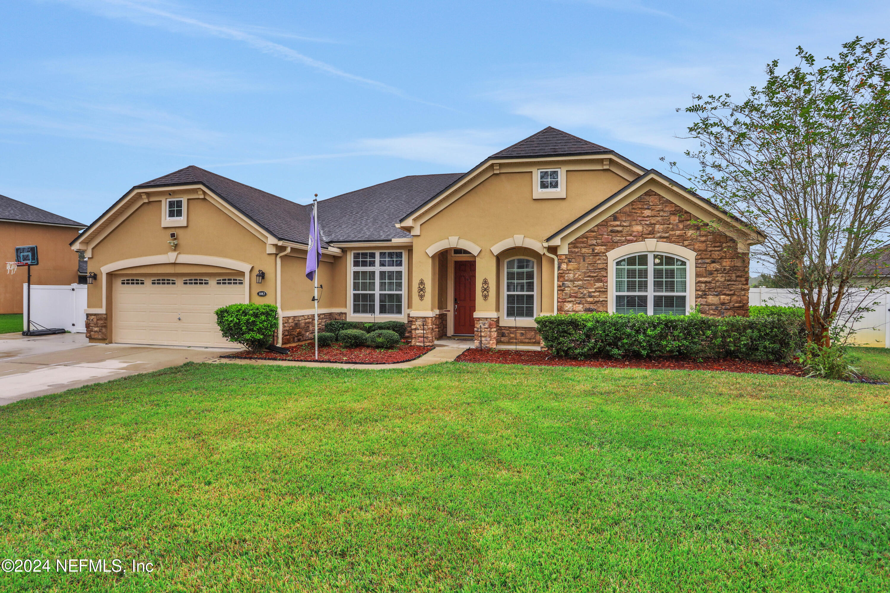 a front view of a house with a yard