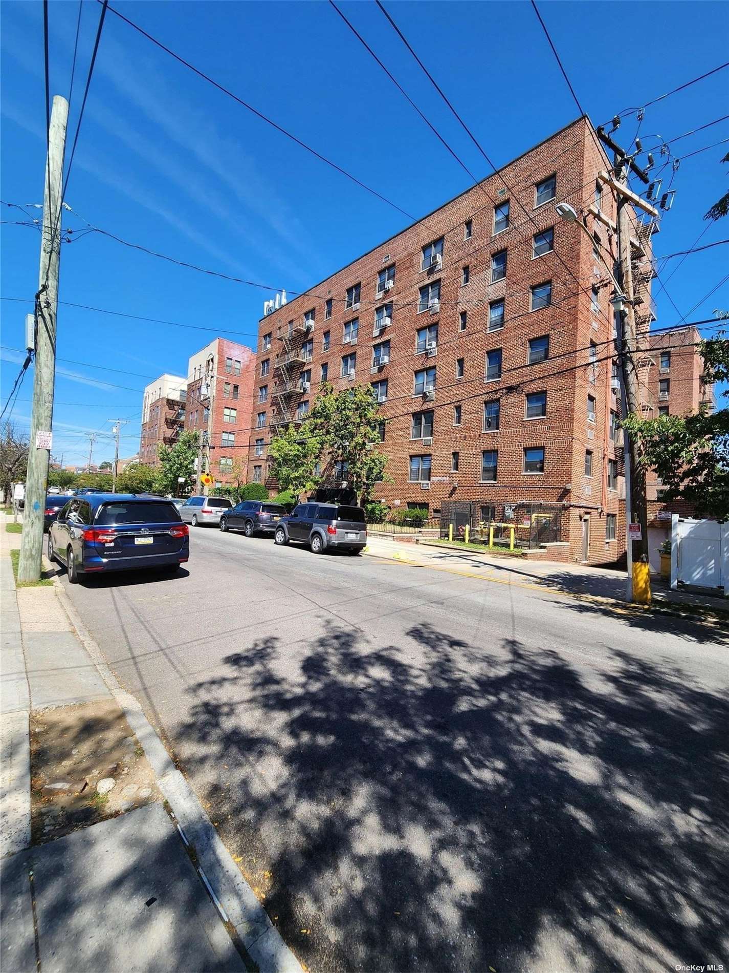 a view of street with parked cars