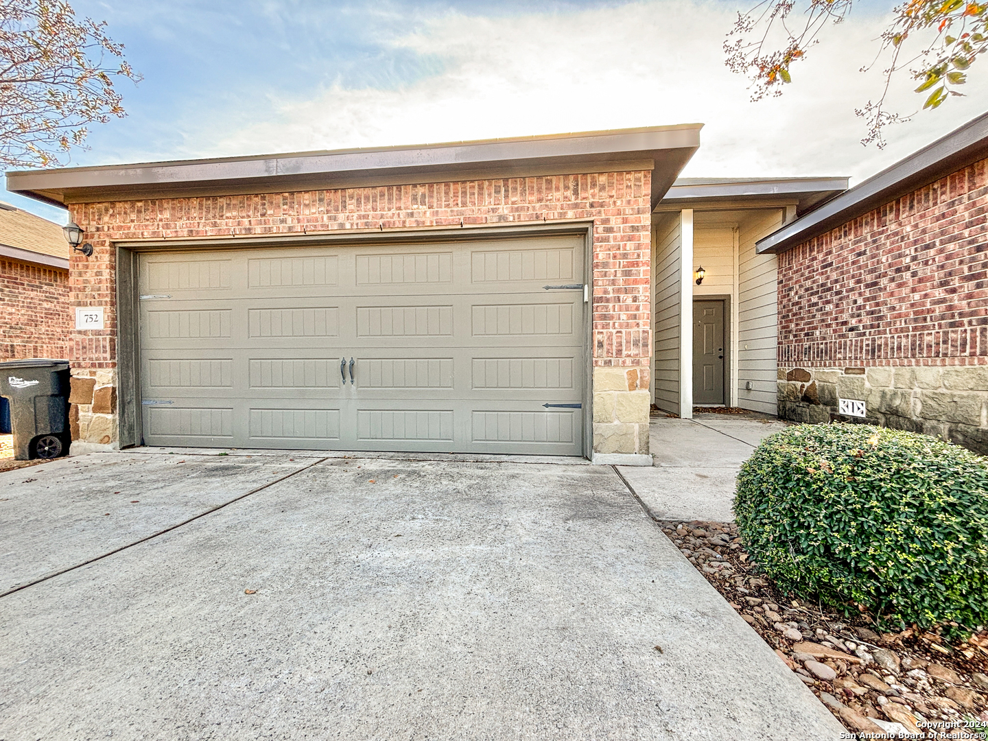 a front view of a house with a garage