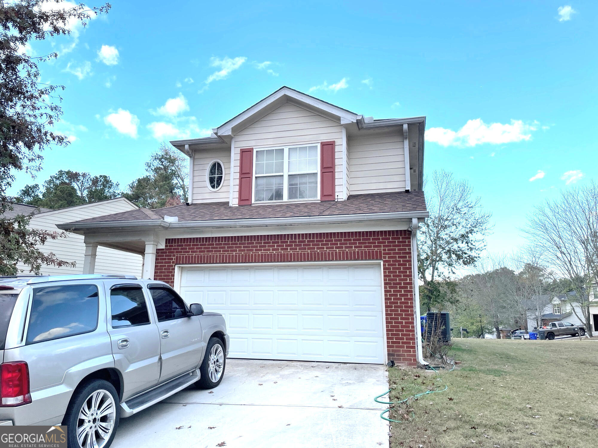 a front view of a house with parking