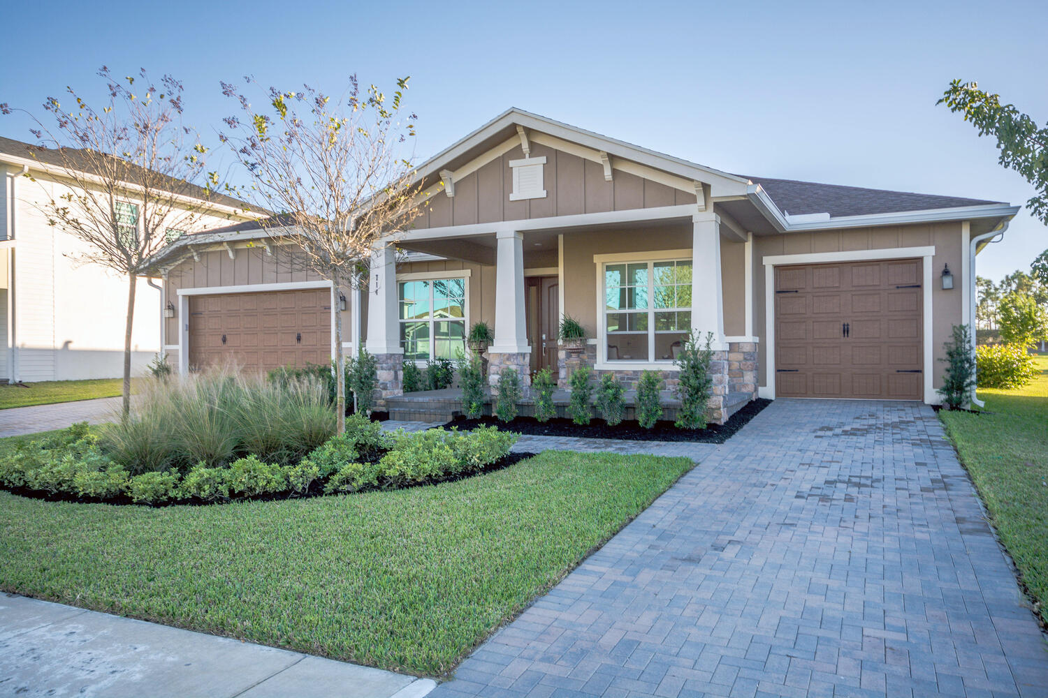 a front view of a house with garden