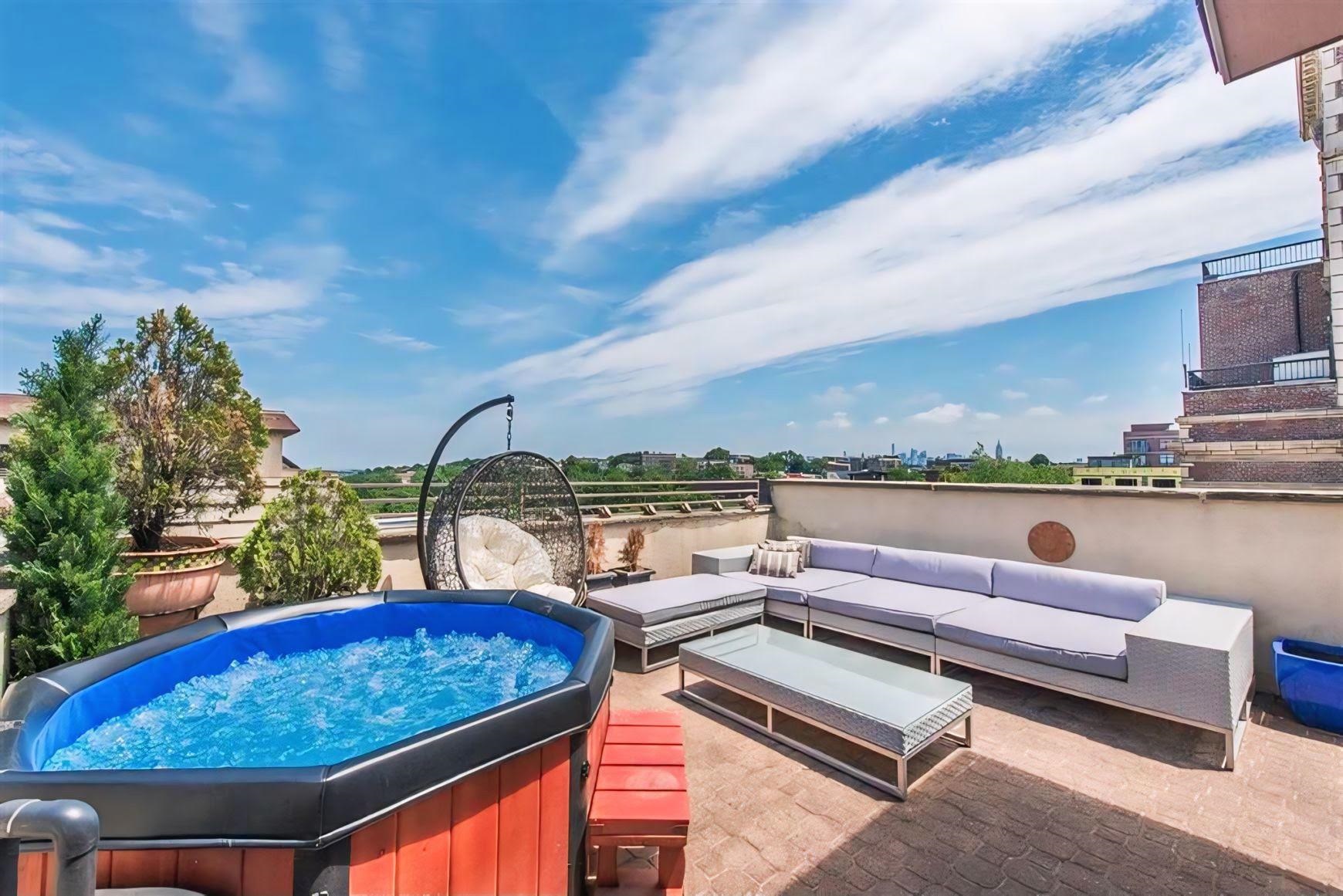 a view of a terrace with couches and pool