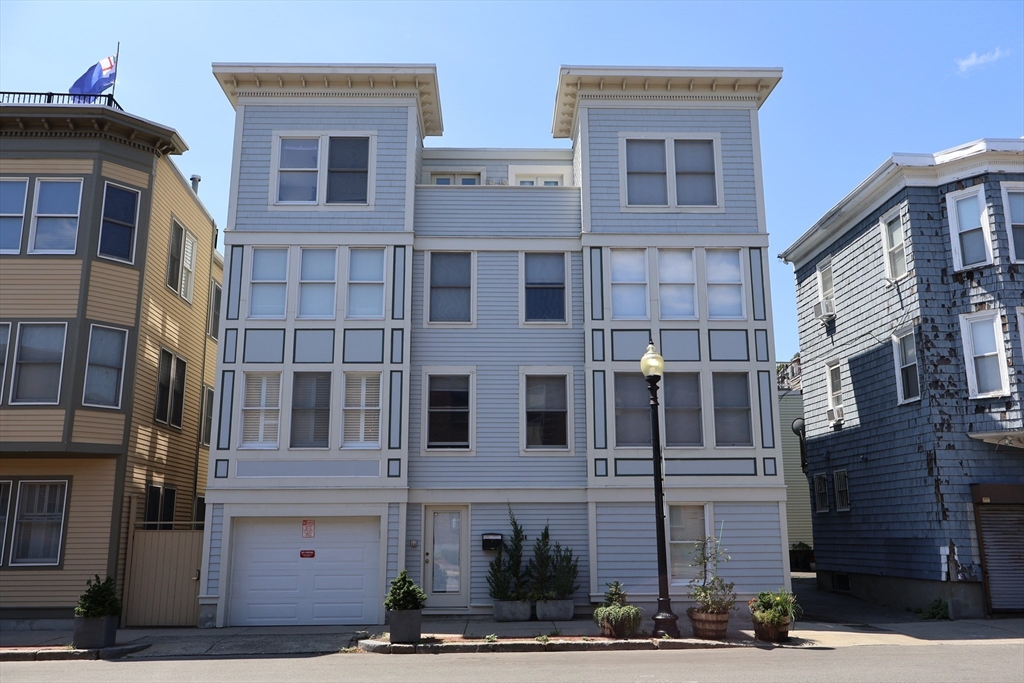 a front view of a building with many windows