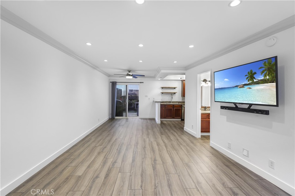 a view of kitchen with furniture wooden floor and window