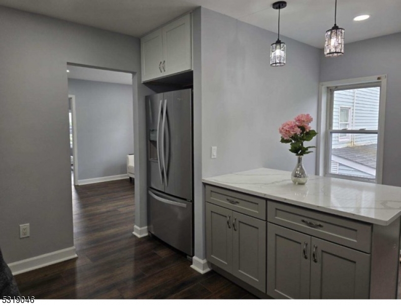 a kitchen with a refrigerator and countertop