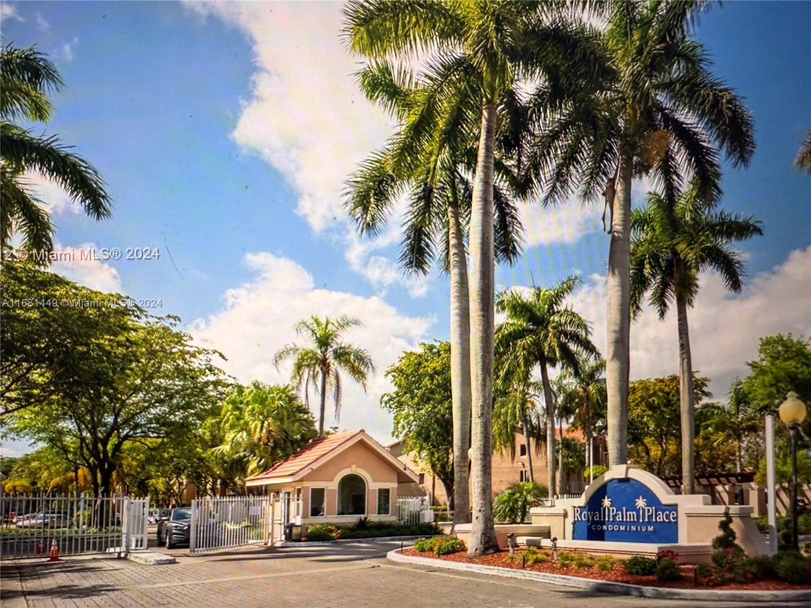 a view of street with palm trees