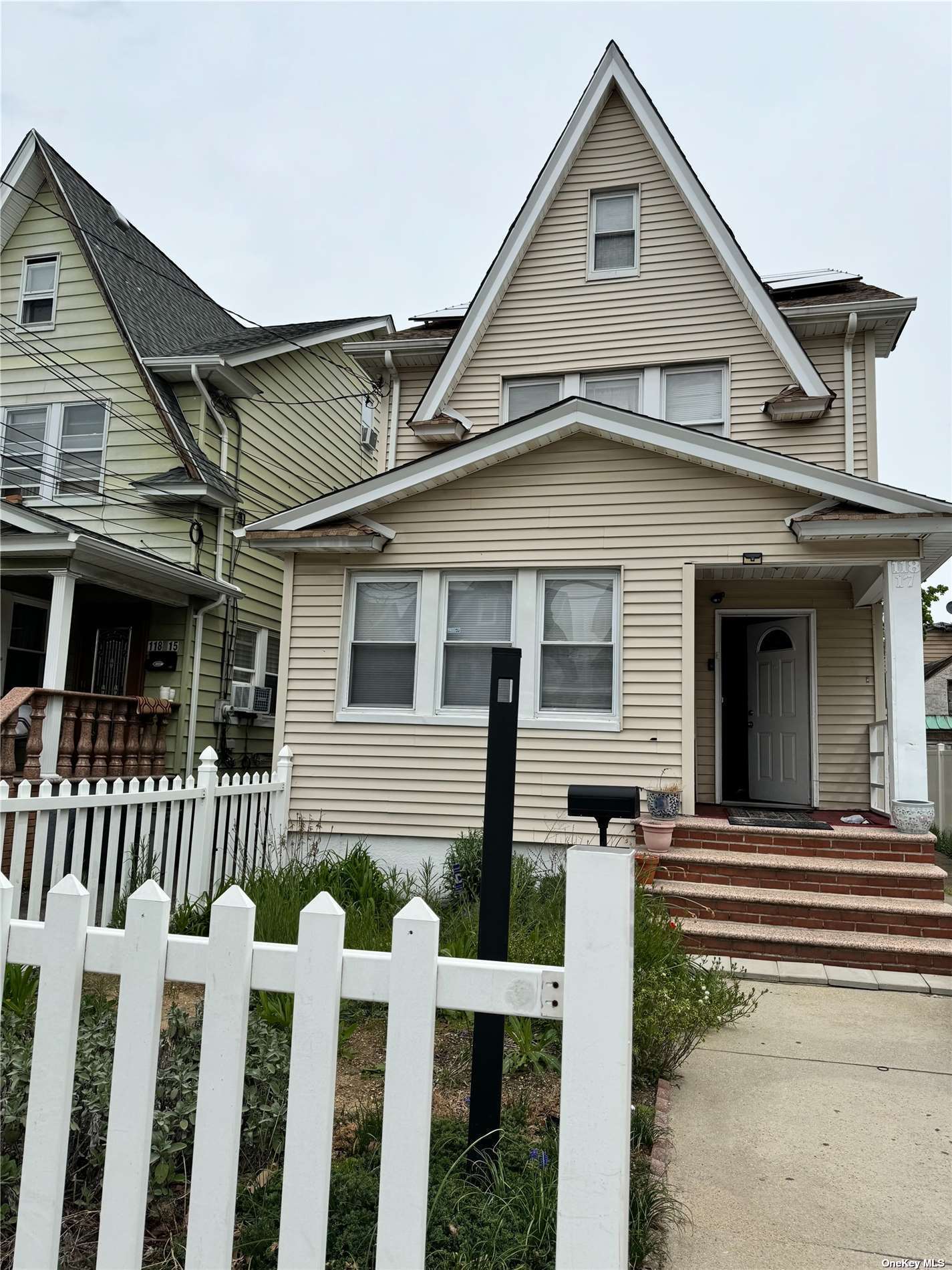 a front view of a house with a porch