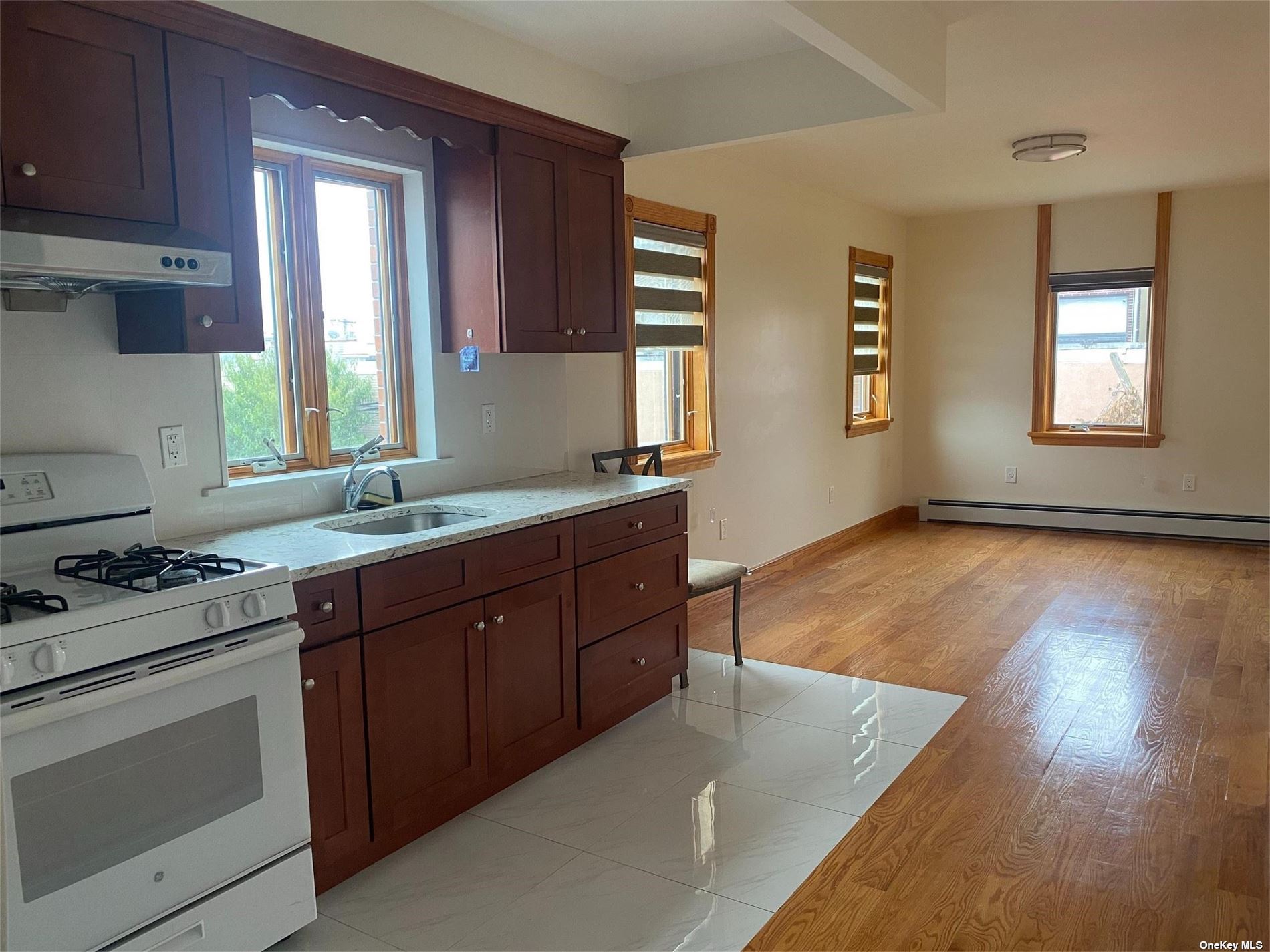 a kitchen with wooden floors and sink