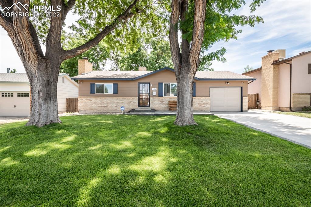 front view of a house with a yard