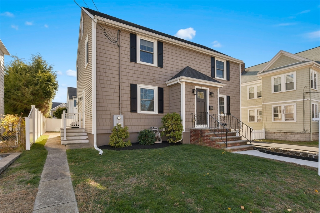 a front view of a house with a yard