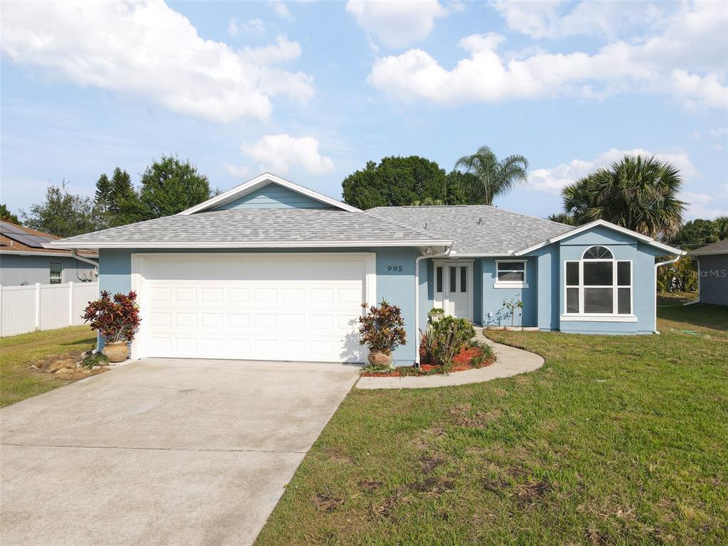 a front view of house with yard outdoor seating and barbeque oven