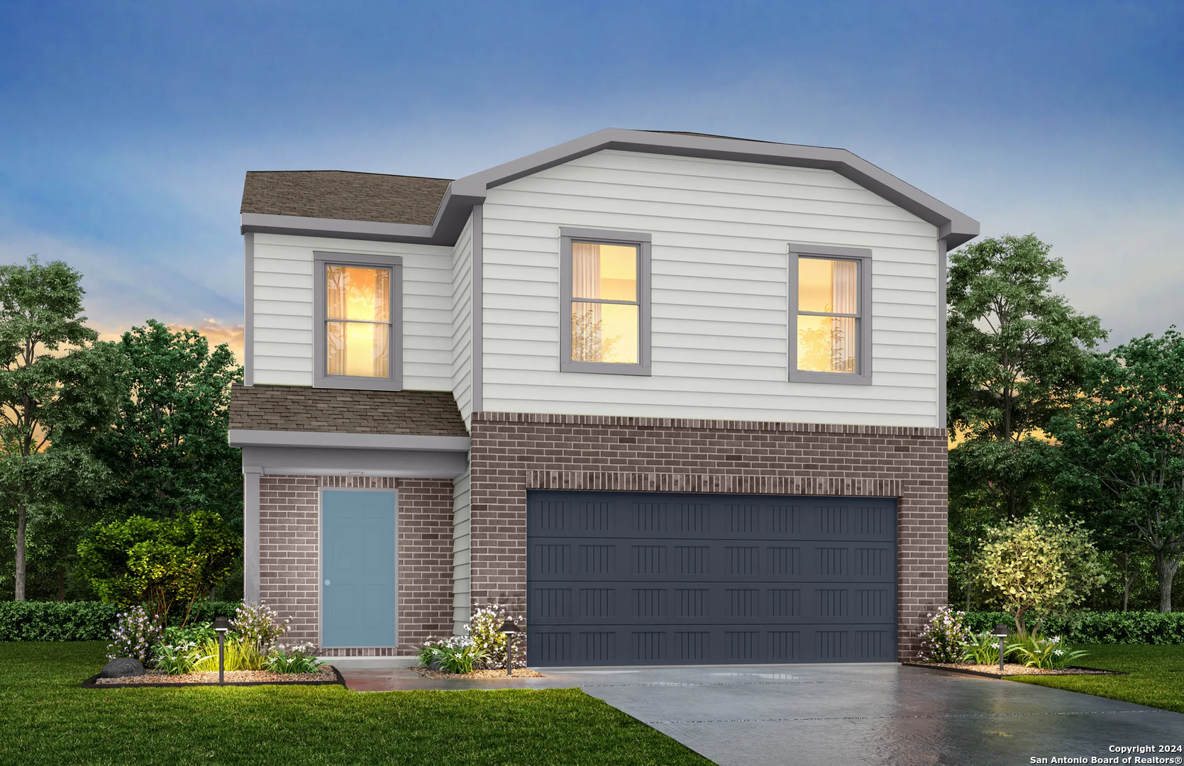 a front view of a house with a yard and garage