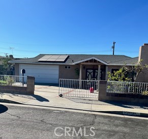 a front view of a house with a fence