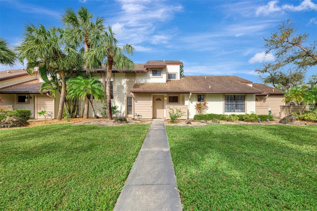 a front view of a house with a yard