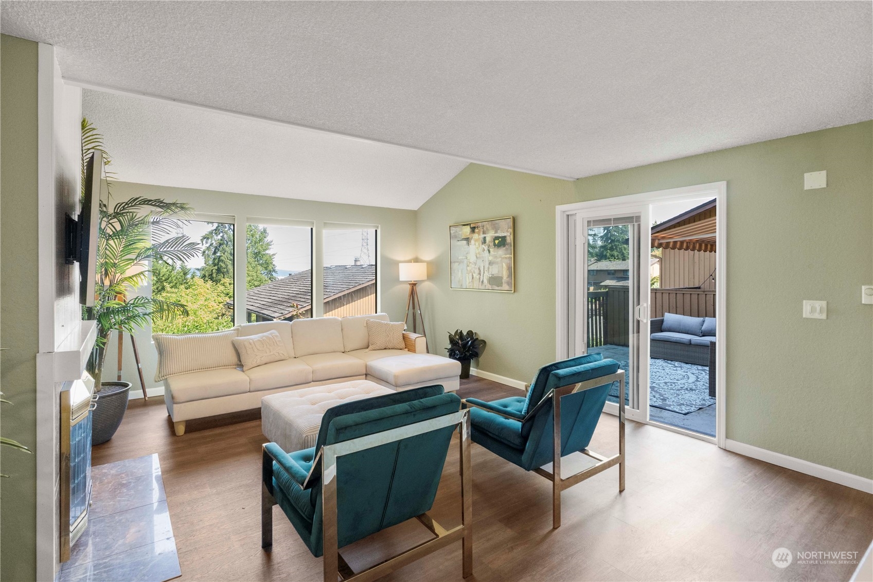 a living room with furniture and a large window