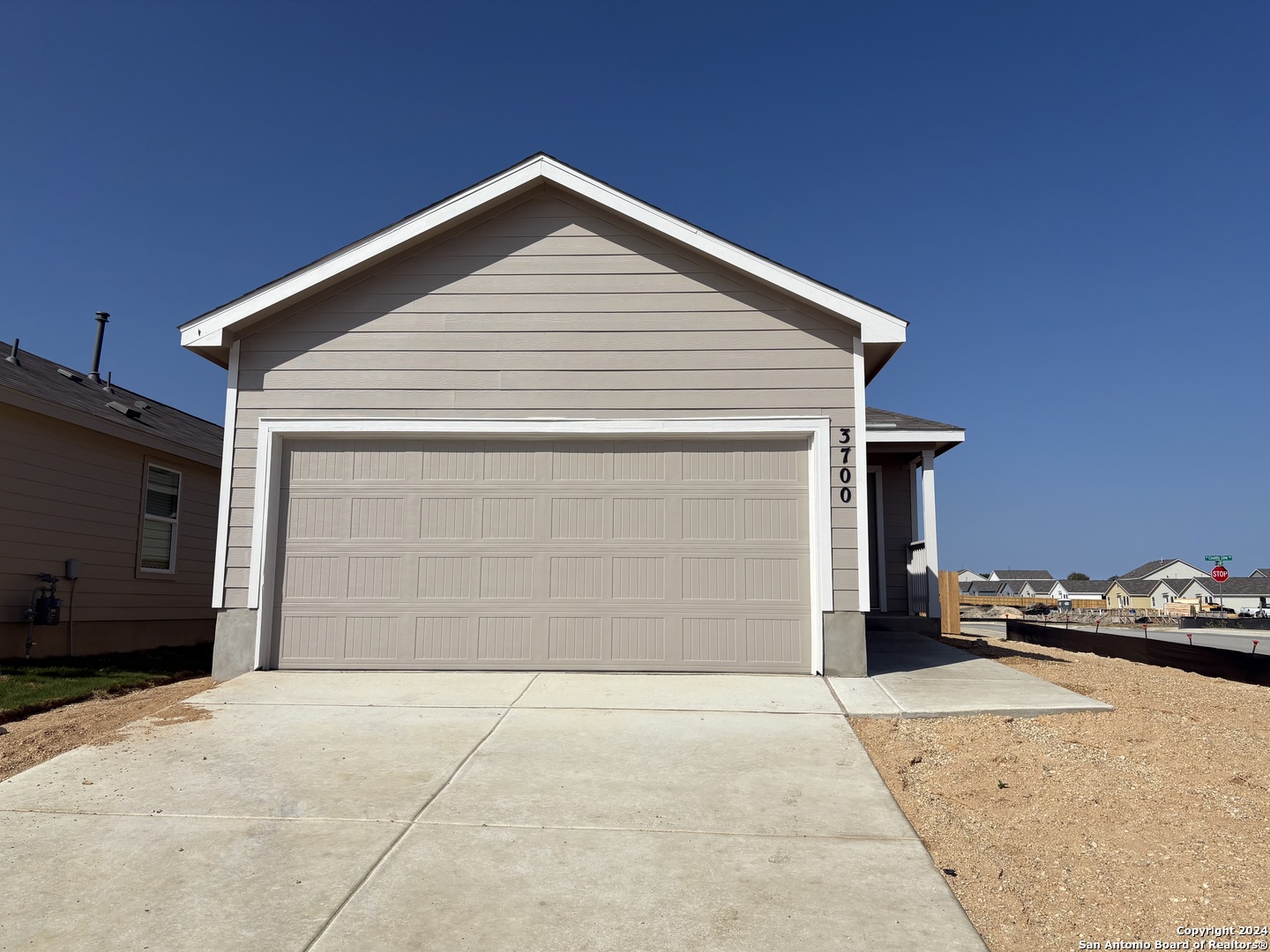 a front view of a house with a garage