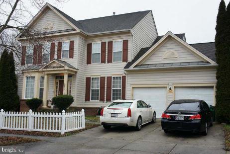 a car parked in front of a house