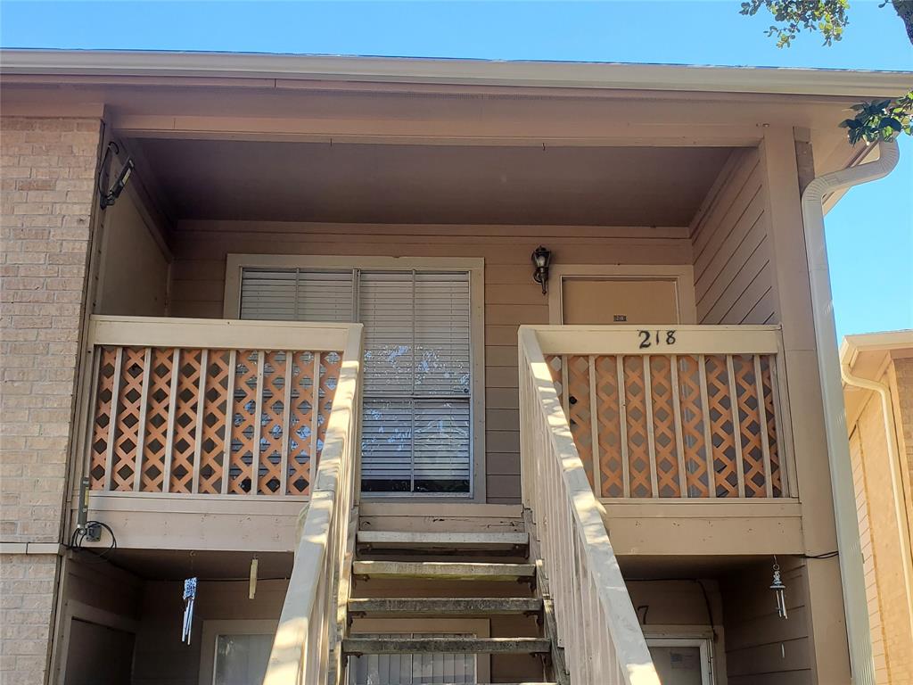 a view of a porch with wooden floor