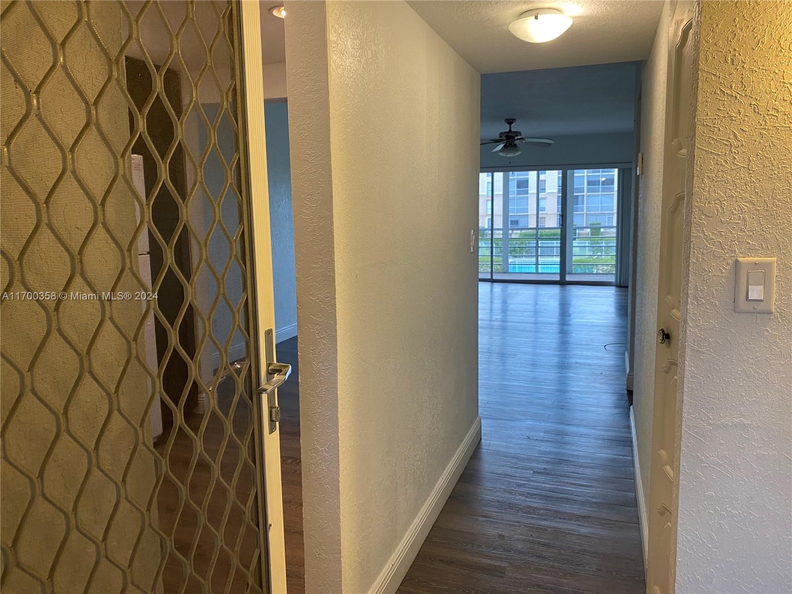 a view of a bathroom from a hallway