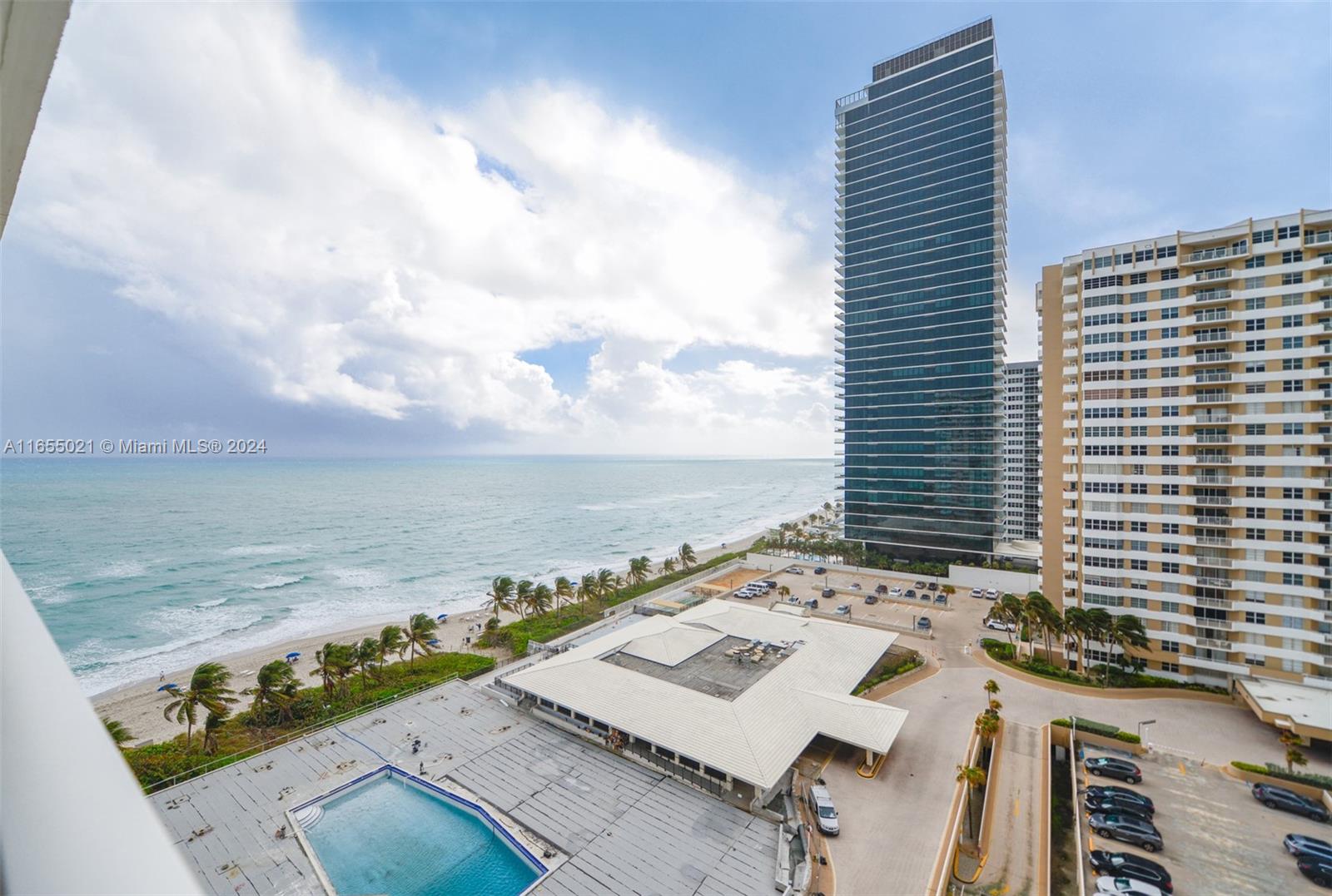 a view of a balcony with an ocean view