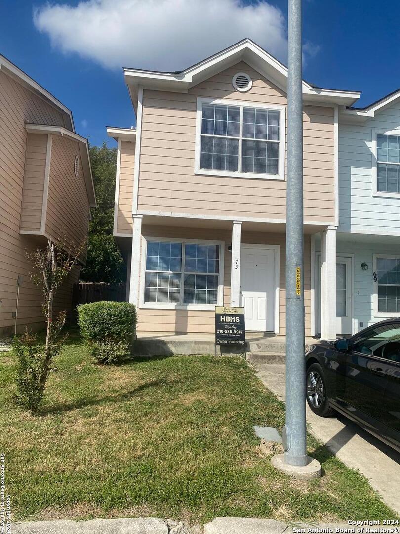 a front view of a house with a yard