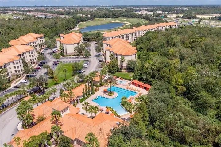 an aerial view of residential houses with outdoor space