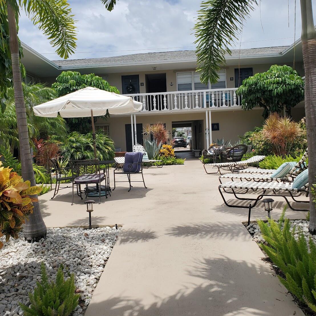 a view of a patio with furniture and a fire pit