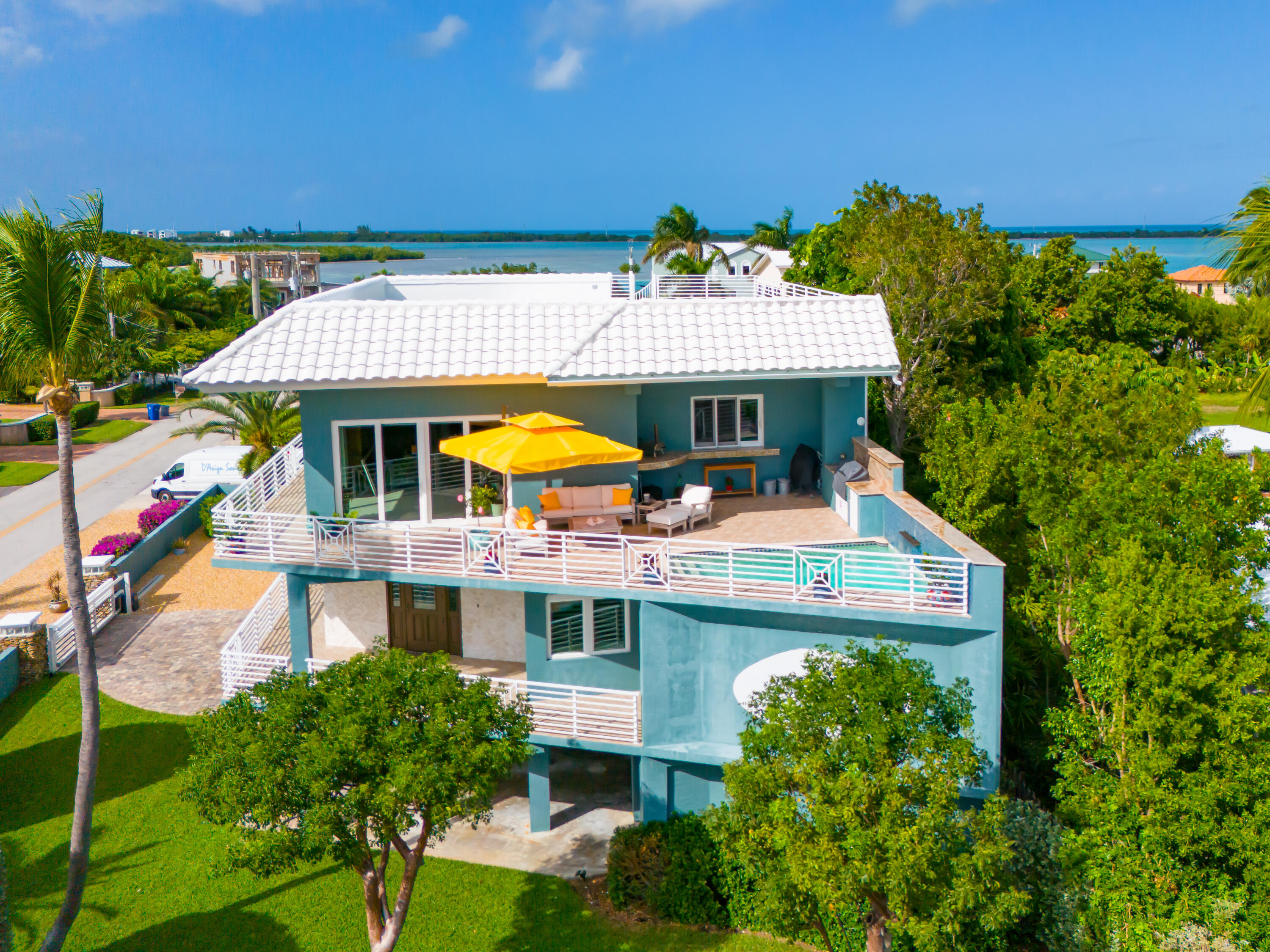 an aerial view of a house with swimming pool garden and patio