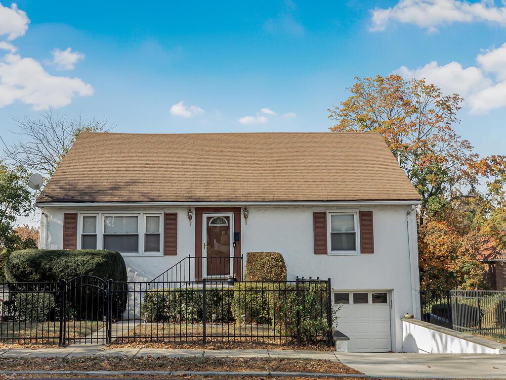 View of front of property featuring a garage