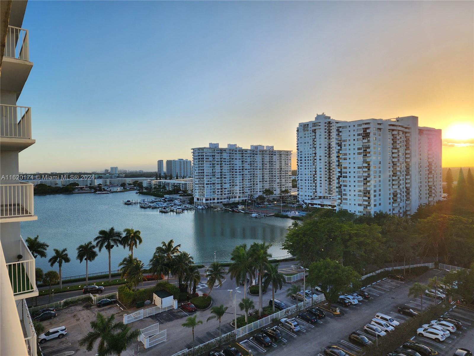 a view of a lake and tall building