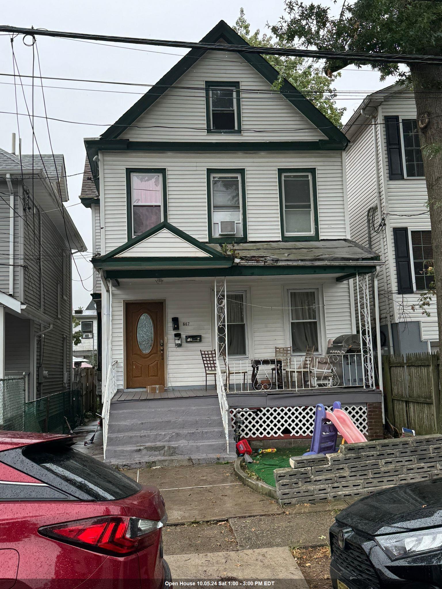 a front view of a house with garage