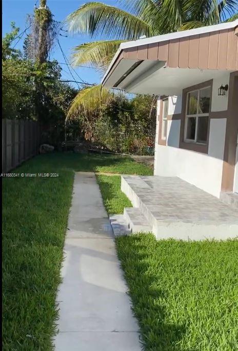 a view of a backyard with plants