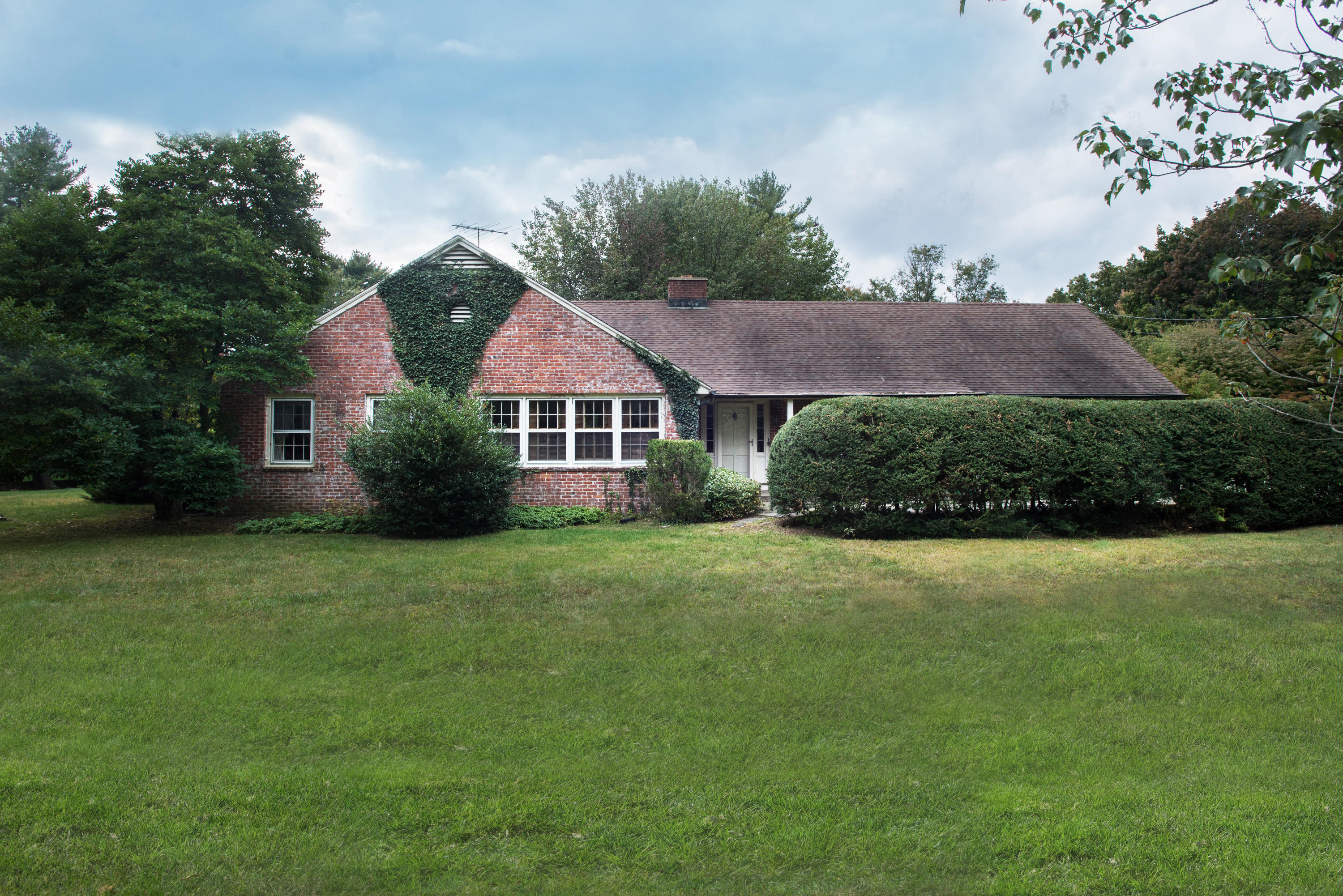 a aerial view of a house with a yard