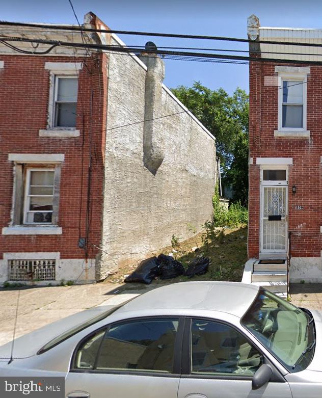 a car parked in front of a house