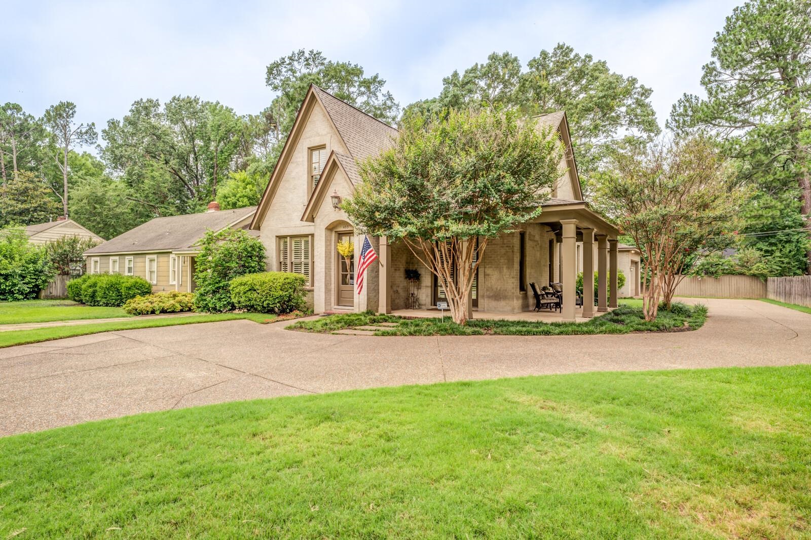 Tudor house featuring a front lawn