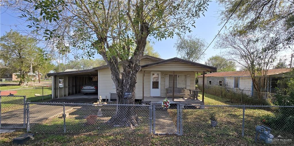 Bungalow-style house featuring a carport