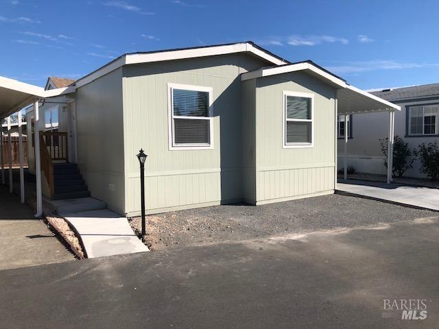 a front view of a house with garage