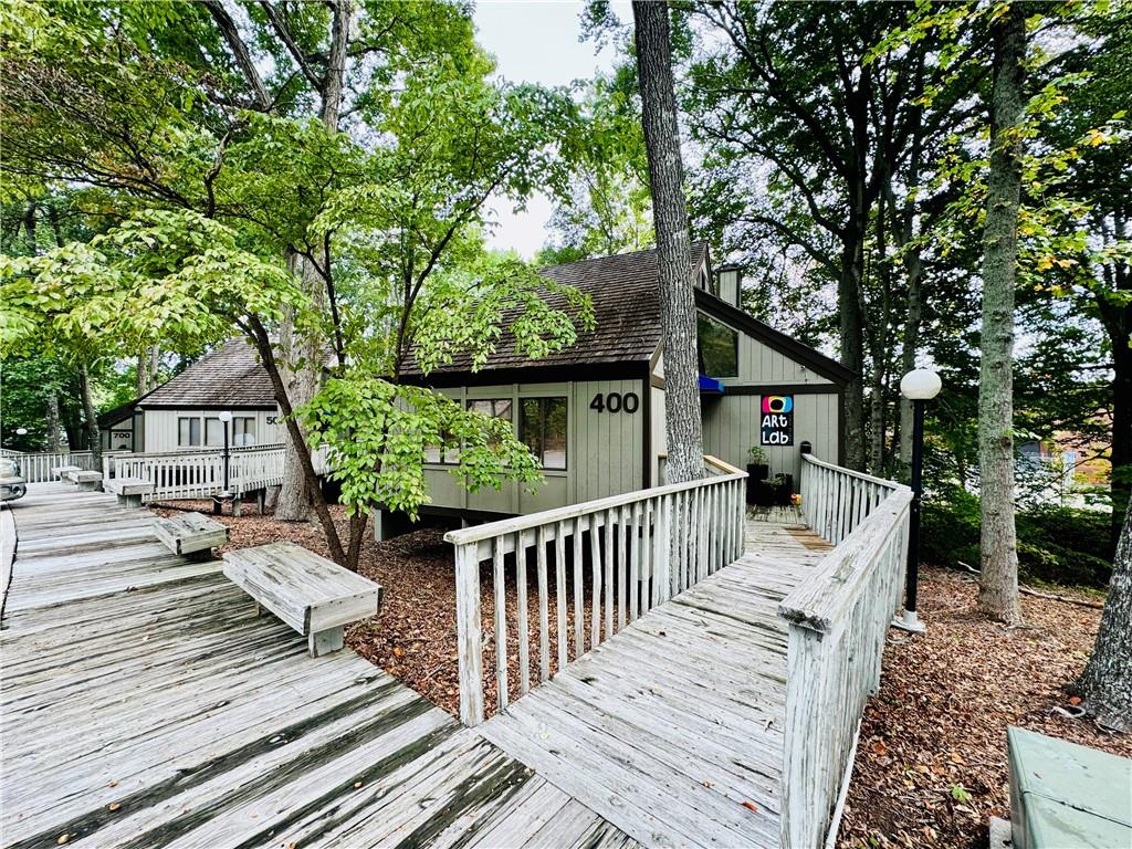 a view of a wooden deck and a patio