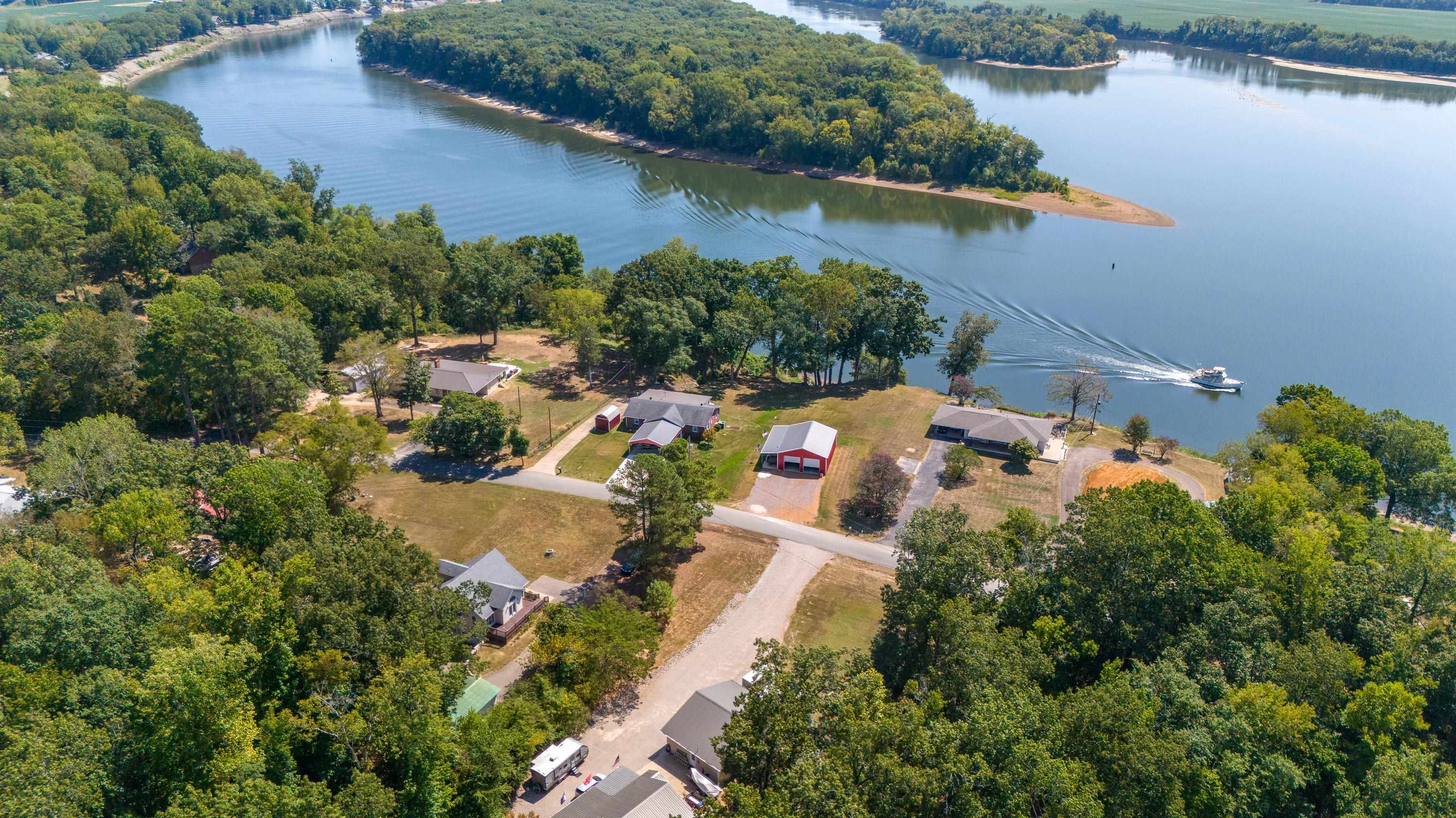 an aerial view of a house with a lake view